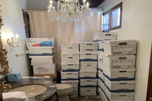 This image, contained in the indictment against former President Donald Trump, shows boxes of records stored in a bathroom and shower in the Lake Room at Trump's Mar-a-Lago estate in Palm Beach, Fla. A federal judge is set to hear arguments on whether to dismiss the classified documents prosecution of Donald Trump. His lawyers say the former president was entitled under the Presidential Records Act to keep the sensitive documents with him when he left the White House and headed to Florida. (Just