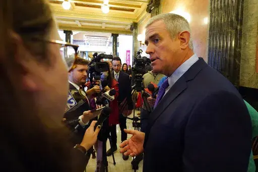 House Speaker Philip Gunn, R-Clinton, responds to a reporter's question following adjournment on the first day of the 2023 Legislature at the Mississippi Capitol in Jackson, Tuesday, Jan. 3, 2023. (AP Photo/Rogelio V. Solis)