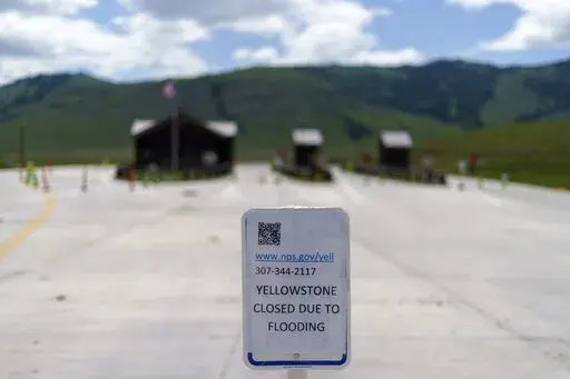 The entrance to Yellowstone National Park, a major tourist attraction, sits closed due to the historic floodwaters on June 15, 2022, in Gardiner, Mont. Created in 1872 as the United States was recovering from the Civil War, Yellowstone was the first of the national parks that have been referred to as America's best idea. Now, the home to soaring geysers and some of the country's most plentiful and diverse wildlife is facing its biggest challenge in decades. (AP Photo/David Goldman, File)