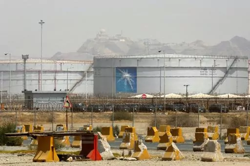 Storage tanks are seen at the North Jiddah bulk plant, an Aramco oil facility, in Jiddah, Saudi Arabia, on March 21, 2021. Saudi Arabia said Thursday, Aug. 3, 2023, it will extend its unilateral production cut of 1 million barrels of oil a day through the end of September in its effort to boost flagging energy prices. (AP Photo/Amr Nabil, File)