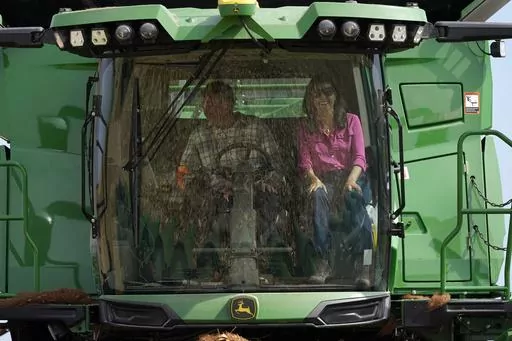 Republican presidential candidate former U.N. Ambassador Nikki Haley rides in a combine with farmer Dennis Campbell, left, during a tour of the Crystal Creek Enterprises farm, Friday, Sept. 15, 2023, in Grand Mound, Iowa. (AP Photo/Charlie Neibergall, File)