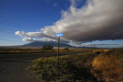 A street sign leads to what was once the home of Paul Adams and his family on the outskirts of Bisbee, Ariz., on Oct 26, 2021. An Arizona judge has ruled that the Church of Jesus Christ of Latter-day Saints may not use the state's “clergy-penitent privilege” to refuse to answer questions or turn over documents in a child sex-abuse case.  (AP Photo/Dario Lopez-Mills, File)
