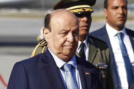 Yemen's President Abed Rabbo Mansour Hadi walks next of his Tunisian counterpart Beji Caid Essebsi, not in photo, upon his arrival at Tunis-Carthage international airport to attend the Arab Summit, in Tunis, Tunisia, March 30, 2019. Yemen’s exiled president stepped aside and transferred his powers to a presidential council on Thursday, April 7, 2022, as international and regional efforts to end the country’s long-running civil war gained momentum with a two-month truce.(AP Photo/Hussein Mall