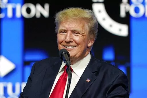 Former President Donald Trump smiles as he pauses while speaking to supporters at a Turning Point Action gathering in Phoenix, July 24, 2021. A congressional oversight committee on Thursday, April 7, 2022, said the Justice Department is “obstructing” its investigation into Trump's handling of White House records by preventing the release of information from the National Archives. (AP Photo/Ross D. Franklin, File)