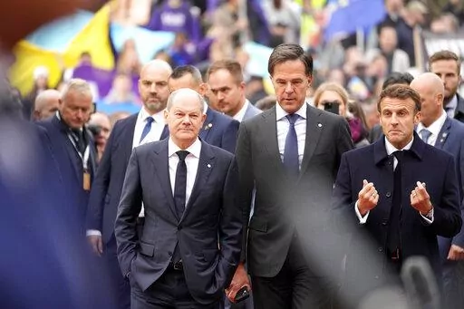 From left, Germany's Chancellor Olaf Scholz, Netherland's Prime Minister Mark Rutte and French President Emmanuel Macron arrive for an EU Summit at Prague Castle in Prague, Czech Republic, Friday, Oct 7, 2022. European Union leaders enter a crucial stretch this week to make sure runaway energy prices and short supplies do not further tank their struggling economies and foment unrest. At the same time, they need to keep all 27 members united in their opposition of Russian President Vladimir Putin
