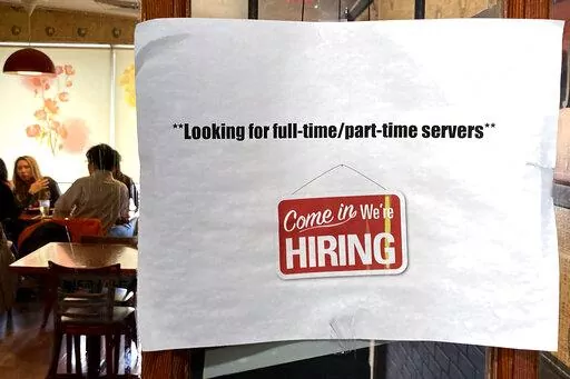 A hiring sign is displayed at a restaurant in Morton Grove, Ill., Thursday, April 28, 2022.  Labor Department releases weekly report on unemployment benefits on Wednesday, Nov. 23.  (AP Photo/Nam Y. Huh, File)
