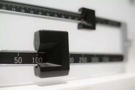 This Tuesday, April 3, 2018 file photo shows a closeup of a beam scale in New York. High-dose oral versions of the medication in the weight-loss drug Wegovy may work as well as injections at paring pounds and improving health, including hard-to-treat people with diabetes, according to research released Sunday, June 25, 2023. (AP Photo/Patrick Sison, File)
