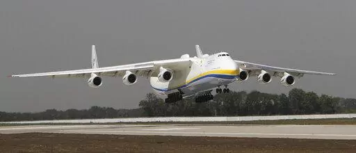 The Ukrainian Antonov-225 Mriya (Dream), the world's heaviest and largest aircraft, makes a test landing at the new runway at the airport in Donetsk, Ukraine on July 26, 2011. Ukraine's defense industry conglomerate says the world's largest plane that was in regular operation was heavily damaged in fighting with Russian troops at the airport outside Kyiv where it was parked. (AP Photo/Sergey Vaganov, File)