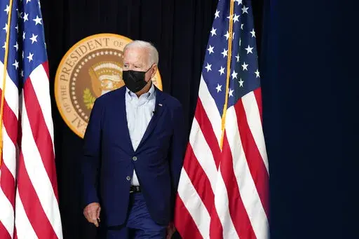 President Joe Biden arrives to attend a FEMA briefing on Hurricane Ida in the South Court Auditorium in the Eisenhower Executive Office Building on the White House Campus, Saturday, Aug. 28, 2021, in Washington. (AP Photo/Manuel Balce Ceneta)