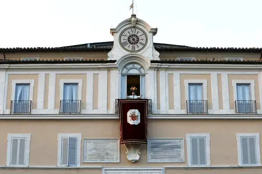 Pope Benedict XVI greets faithful from his summer residence of Castel Gandolfo, the scenic town where he spent his first post-Vatican days and made his last public blessing as pope, Feb. 28, 2013. Pope Emeritus Benedict XVI's death has hit Castel Gandolfo's "castellani" particularly hard, since many knew him personally, and in some ways had already bid him an emotional farewell when he uttered his final words as pope from the palace balcony overlooking the town square. (AP Photo/Luca Bruno, File