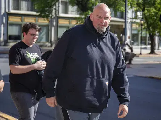 John Fetterman arrives at the Holy Hound Tap Room in downtown York, Pa., Thursday, May. 12, 2022. (Mark Pynes/The Patriot-News via AP)