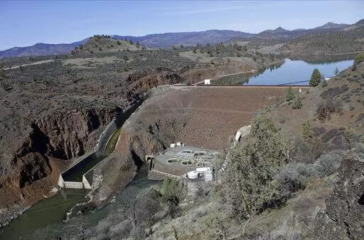The Iron Gate Dam, powerhouse and spillway is seen on the lower Klamath River near Hornbrook, Calif, on March 3, 2020. The largest dam demolition and river restoration plan in the world could be close to reality Thursday, Nov. 17, 2022, as U.S. regulators vote on a plan to remove four aging hydro-electric structures, reopening hundreds of miles of California river habitat to imperiled salmon. (AP Photo/Gillian Flaccus, File)