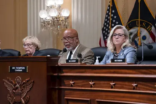 Chairman Bennie Thompson, D-Miss., center, flanked by Rep. Zoe Lofgren, D-Calif., left, and Vice Chair Liz Cheney, R-Wyo., makes a statement as the House committee investigating the Jan. 6 attack on the U.S. Capitol pushes ahead with contempt charges against former advisers to Donald Trump, Peter Navarro and Dan Scavino, in response to their refusal to comply with subpoenas, at the Capitol in Washington, Monday, March 28, 2022. Navarro, President Donald Trump's trade adviser, and Scavino, a Whit