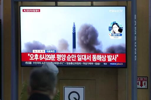 People watch a TV screen showing a news program reporting about North Korea's missile launch with file footage, at a train station in Seoul, South Korea, Thursday, May 12, 2022. South Korea says North Korea has fired a total of three short-range ballistic missiles toward the sea. South Korea's Joint Chiefs of Staff says the three missiles launched from the North's capital region on Thursday afternoon flew toward the waters off the country's eastern coast. (AP Photo/Lee Jin-man)