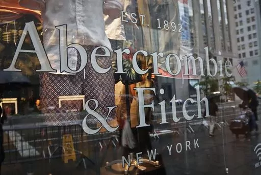 In this May 22, 2017, file photo, a store window reflects a street scene at an Abercrombie & Fitch store on New York's Fifth Avenue. A former model for Abercrombie & Fitch has sued the fashion retailer, Friday, Oct. 27, 2023, alleging it allowed its former CEO Mike Jeffries to run a sex-trafficking organization during his 22-year tenure.(AP Photo/Bebeto Matthews, File)