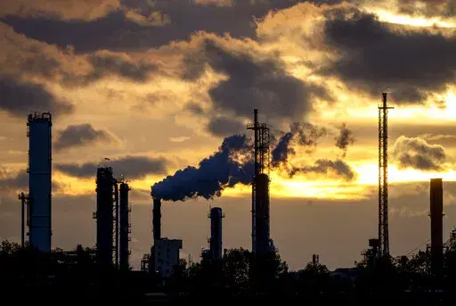 Pollution rises from the BASF chemical plant in Ludwigshafen, Germany, Monday, Nov. 7, 2022. (AP Photo/Michael Probst)