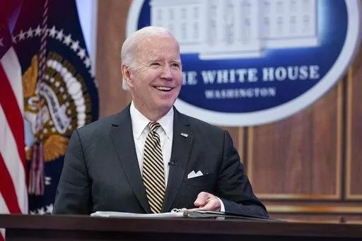 President Joe Biden smiles as he speaks about infrastructure in the South Court Auditorium on the White House complex in Washington, Oct. 19, 2022. Facing a midterm election that will define, and quite possibly constrict, the next two years of his term, President Joe Biden is treading a difficult line. At once he is the optimist, with a fulsome promise of better days ahead, only to then paint a what he sees as a darker portrait of a Congress potentially controlled by hard-right Republicans.  (AP