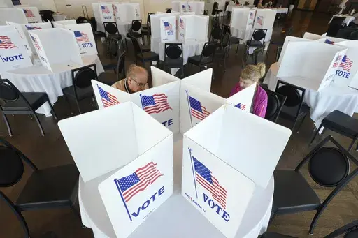 Voters fill out their ballots for the Michigan primary election, Feb. 27, 2024, in Grosse Pointe Farms, Mich. (AP Photo/Paul Sancya, File)