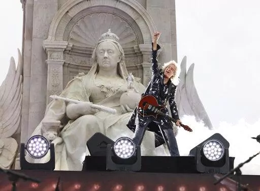 Queen guitarist Brian May performs during the Platinum Jubilee concert taking place in front of Buckingham Palace, London, on June 4, 2022, on the third of four days of celebrations to mark the Platinum Jubilee. Brian May is now a “Sir.” May, who also has a doctorate in astrophysics and is an animal welfare advocate, received a knighthood Friday Dec. 30, 2022 as part of the U.K.'s annual New Year's Honors list. (Jonathan Buckmaster/Pool Photo via AP, File)