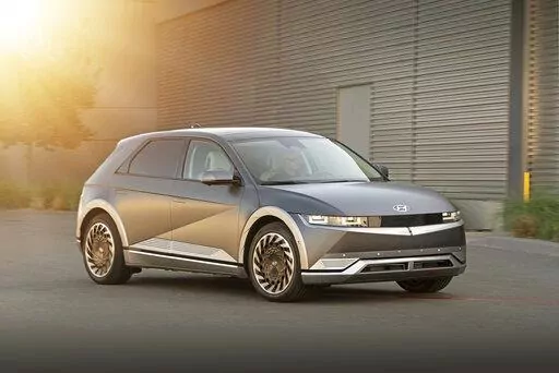 This photo provided by Hyundai shows the 2022 Hyundai Ioniq 5, a small electric SUV with retro-inspired looks and up to 303 miles of EPA-estimated range. (David Dewhurst/Courtesy of Hyundai Motor America via AP)