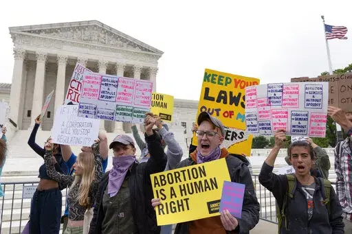 Demonstrators protest outside of the U.S. Supreme Court Tuesday, May 3, 2022 in Washington. A draft opinion suggests the U.S. Supreme Court could be poised to overturn the landmark 1973 Roe v. Wade case that legalized abortion nationwide, according to a Politico report released Monday. Whatever the outcome, the Politico report represents an extremely rare breach of the court's secretive deliberation process, and on a case of surpassing importance. (AP Photo/Jose Luis Magana)