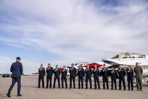 President Joe Biden greats a group of Thunderbird pilots after arriving at Peterson Space Force Base in Colorado Springs, Colo., Wednesday, May 31, 2023. Biden has decided to keep U.S. Space Command headquarters in Colorado, overturning a last-ditch decision by the Trump administration to move it to Alabama and ending months of politically fueled debate, according to senior U.S. officials. (AP Photo/Andrew Harnik, File)
