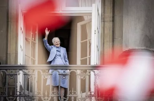 Denmark's Queen Margrethe II waves from the balcony during celebrations for her 83rd birthday, at Amalienborg Castle in Copenhagen, Sunday, April 16, 2023. Queen Margrethe II, Denmark’s monarch for more than half a century, stunned her country when she announced on New Year’s Eve that she will hand over the throne to her eldest son, Crown Prince Frederik, on Jan. 14, 2024. It’s the first time a Danish monarch has stepped down voluntarily in nearly 900 years. (Mads Claus Rasmussen/Ritzau Sc