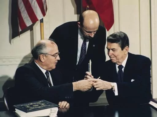 U.S. President Ronald Reagan, right, and Soviet leader Mikhail Gorbachev exchange pens at a signing ceremony of the Intermediate Range Nuclear Forces Treaty in the White House East Room in Washington, D.C., on Dec. 8, 1987. Both countries pulled out of the treaty in 2019, blaming each other for violations. On Tuesday, Nov. 7, 2023, Russia pulled out of the Treaty of Conventional Armed Forces in Europe and NATO member countries froze their participation in the pact, which was aimed at preventing 