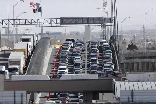 Cars and trucks line up to enter the U.S. from Mexico at a border crossing in El Paso, Texas, March 29, 2019. Most Americans think the U.S. has been significantly changed by immigrants over the past five years and while many agree immigrants contribute to the economy, there are broad concerns that even legal immigration brings risks as well, according to a new poll from The Associated Press-NORC Center for Public Affairs Research, conducted March 21-25, 2024. (AP Photo/Gerald Herbert, File)