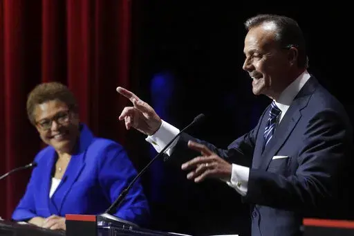 U.S. Rep. Karen Bass smiles at a point made by businessman Rick Caruso during a mayoral debate, Tuesday, March 22, 2022, in Los Angeles. Los Angeles voters are picking a new mayor amid widespread frustration with homelessness and crime. Twelve names are on the primary ballot but the contest has narrowed to a mostly two-person fight between Bass and Caruso. (Genaro Molina/Los Angeles Times via AP, File)