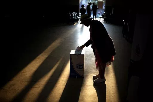 A woman casts her ballot at a polling station, during general elections in Eshowe, South Africa, on May 29, 2024. South Africa is in a moment of deep soul-searching after an election that brought a jarring split from the African National Congress, the very party that gave the country freedom and democracy 30 years ago. (AP Photo/Emilio Morenatti, File)