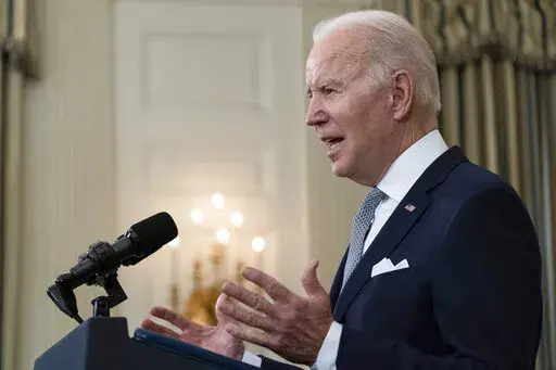 President Joe Biden speaks about the 2021 jobs report in the State Dining Room of the White House, Friday, Jan. 7, 2022, in Washington. (AP Photo/Alex Brandon)