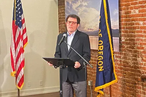 Former New York Times columnist Nick Kristof speaks at a news conference in Portland, Oregon, on Thursday, Feb. 17, 2022. The Oregon Supreme Court ruled Thursday Kristof is not eligible to run for governor because he does not meet the state's three-year residency requirement. (AP Photo/Sara Cline)