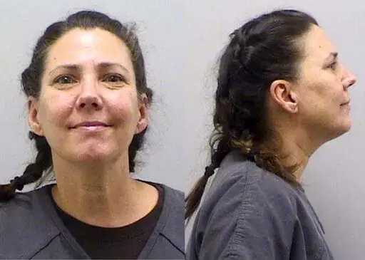 This undated booking photo provided by the Douglas County Sheriff's Office, in Colorado, shows Cynthia Abcug. The Colorado mother accused of plotting to kidnap her son from foster care after her teen daughter said she started associating with supporters of the QAnon conspiracy theory was found guilty of conspiracy to commit second-degree kidnapping on Friday, Aug. 26, 2022. (Douglas County Sheriff's Office via AP, File)