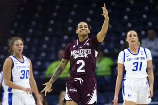 Mississippi State's JerKaila Jordan (2) celebrates after a 3-point basket as Creighton's Morgan Maly (30) and Emma Ronsiek (31) look on during the first half of a first-round college basketball game in the NCAA Tournament, Friday, March 17, 2023, in South Bend, Ind. (AP Photo/Michael Caterina)