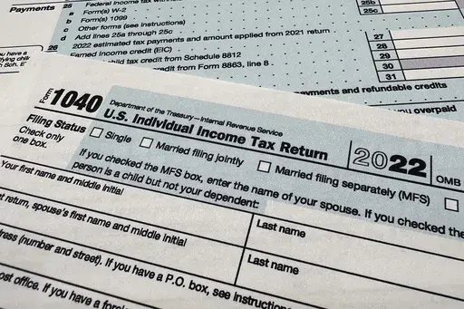The Internal Revenue Service 1040 tax form for 2022 is seen on April 17, 2023. (AP Photo/Jon Elswick, File)