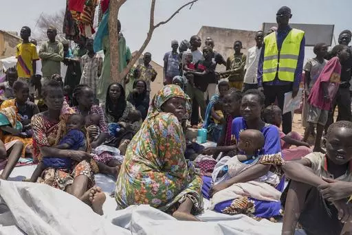 South Sudanese who fled from Sudan sit outside a nutrition clinic at a transit center in Renk, South Sudan, May 16, 2023. The U.N. migration agency told The Associated Press Monday June 10, 2024 that the number of internally displaced people in Sudan has reached more than 10 million. (AP Photo/Sam Mednick, File)