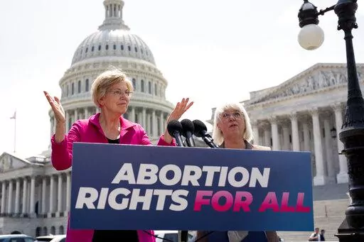 Sen. Elizabeth Warren, D-Mass., and Sen. Patty Murray, D-Wash., talk to reporters as the Supreme Court is poised to possibly overturn Roe v. Wade, at the Capitol in Washington, June 15, 2022.  The Democratic National Committee is launching a digital ad campaign to energize its voters after last month’s Supreme Court decision overturning Roe v. Wade. The ad campaign warns that Republicans’ ultimate goal is to outlaw abortion nationwide.  (AP Photo/J. Scott Applewhite, File)