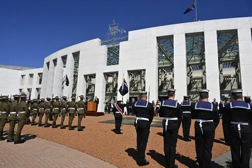 Australia's Governor-General David Hurley, center back, speaks at the proclamation of King Charles III, on the forecourt of Parliament House in Canberra, Sunday, Sept. 11, 2022. Australia's Prime Minister Anthony Albanese defended a protocol that bars the nation's parliament from sitting for 15 days following a British monarch's death. (Mick Tsikas/AAP Image via AP)