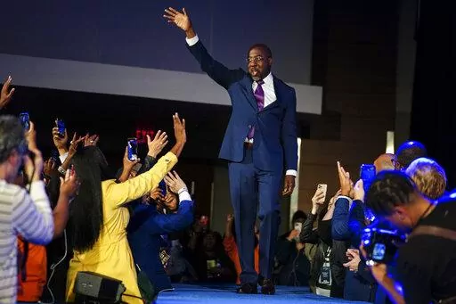 Democratic Sen. Raphael Warnock speaks during an election night watch party, Tuesday, Dec. 6, 2022, in Atlanta. Democratic Sen. Raphael Warnock has defeated Republican challenger Herschel Walker in a runoff election in Georgia. (AP Photo/John Bazemore)