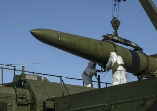 In this photo released by the Russian Defense Ministry Press Service on Feb. 2, 2024, Russian troops load an Iskander missile onto a mobile launcher during drills at an undisclosed location in Russia. Hawks in Russia have called for revising the country's nuclear doctrine to lower the threshold for using nuclear weapons, and President Vladimir Putin said the doctrine could be modified. (Russian Defense Ministry Press Service via AP, File)