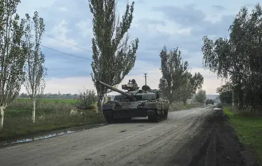 Ukrainian servicemen drive a tank on the way to Siversk, Donetsk region, Ukraine, Saturday, Oct. 1, 2022. (AP Photo/Inna Varenytsia)