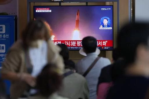 A TV screen showing a news program reporting about North Korea's missile launch with file imagery, is seen at the Seoul Railway Station in Seoul, South Korea, Saturday, Oct. 1, 2022. On Saturday, North Korea fired two short-range ballistic missiles toward its eastern waters, South Korean and Japanese officials said, making it the fourth round of weapons launches this week that are seen as a response to military drills among its rivals. (AP Photo/Lee Jin-man)