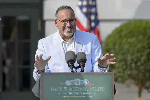 U.S. Secretary of Education Miguel Cardona offers remarks at the first-ever Back-to-School Night at the White House on the South Lawn of the White House in Washington, Sept. 21, 2024. (AP Photo/Rod Lamkey, Jr., File)