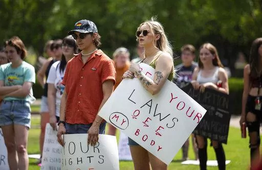 Community members gather to protest the U.S. Supreme Court's overturning of Roe v. Wade and Kentucky's trigger law to ban abortion, at Circus Square Park in Bowling Green, Ky., on Saturday, June 25, 2022.  (Grace Ramey/Daily News via AP, File)