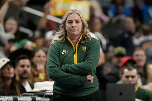 Baylor head coach Nicki Collen watches during the second half of an NCAA college basketball against TCU game for the Big 12 women's tournament championship Sunday, March 9, 2025, in Kansas City, Mo. (AP Photo/Charlie Riedel)