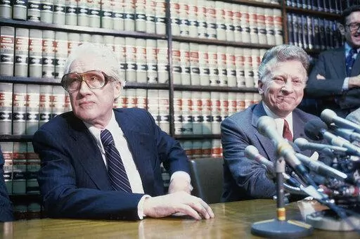 Former FBI officials, Mark Felt, left, and Edward S. Miller, appear at a news conference, April 15, 1981, after learning that President Reagan had pardoned them from their conviction of unauthorized break-ins during the Nixon administration's search for opponents during the Vietnam War. Felt revealed himself as "Deep Throat" 30 years after he tipped off Washington Post reporters Bob Woodward and Carl Bernstein in the Watergate investigation and the wrongdoing by President Richard Nixon and his a