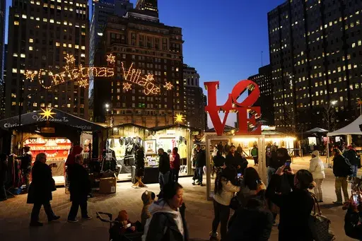Shoppers visit the Christmas Village in Philadelphia, Dec. 13, 2023. (AP Photo/Matt Rourke, File)