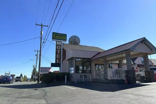 Cars pass by the Emerald Motel and Seattle Inn on Aurora Avenue North in Seattle, on Thursday, Aug. 3, 2023. Police recently declared the establishments to be chronic nuisances due to rampant prostitution and other criminal activity, a step that requires the owners to demonstrate how they will prevent their properties from being used for criminal behavior. The recent harrowing escape of a woman who was abducted after engaging in prostitution on Seattle has helped focus attention on the consequen