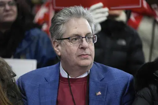 Matthew DePerno listens to Republican presidential candidate, former President Donald Trump, at a campaign rally in Waterford Township, Mich., Feb. 17, 2024. (AP Photo/Paul Sancya, File)